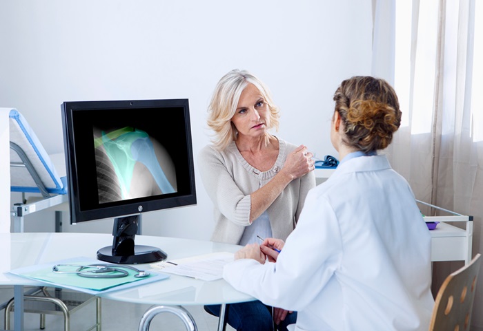 Doctor patient consultation about a shoulder injury