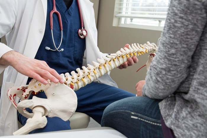 Doctor explaining spine injury
