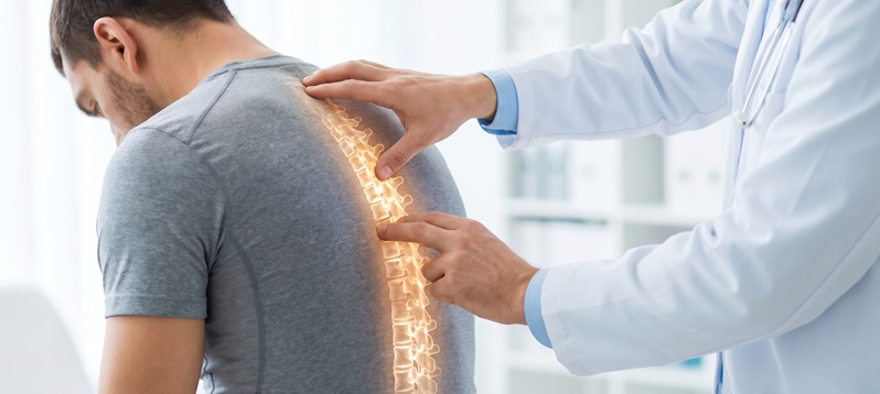 Pain doctor assessing an back injury